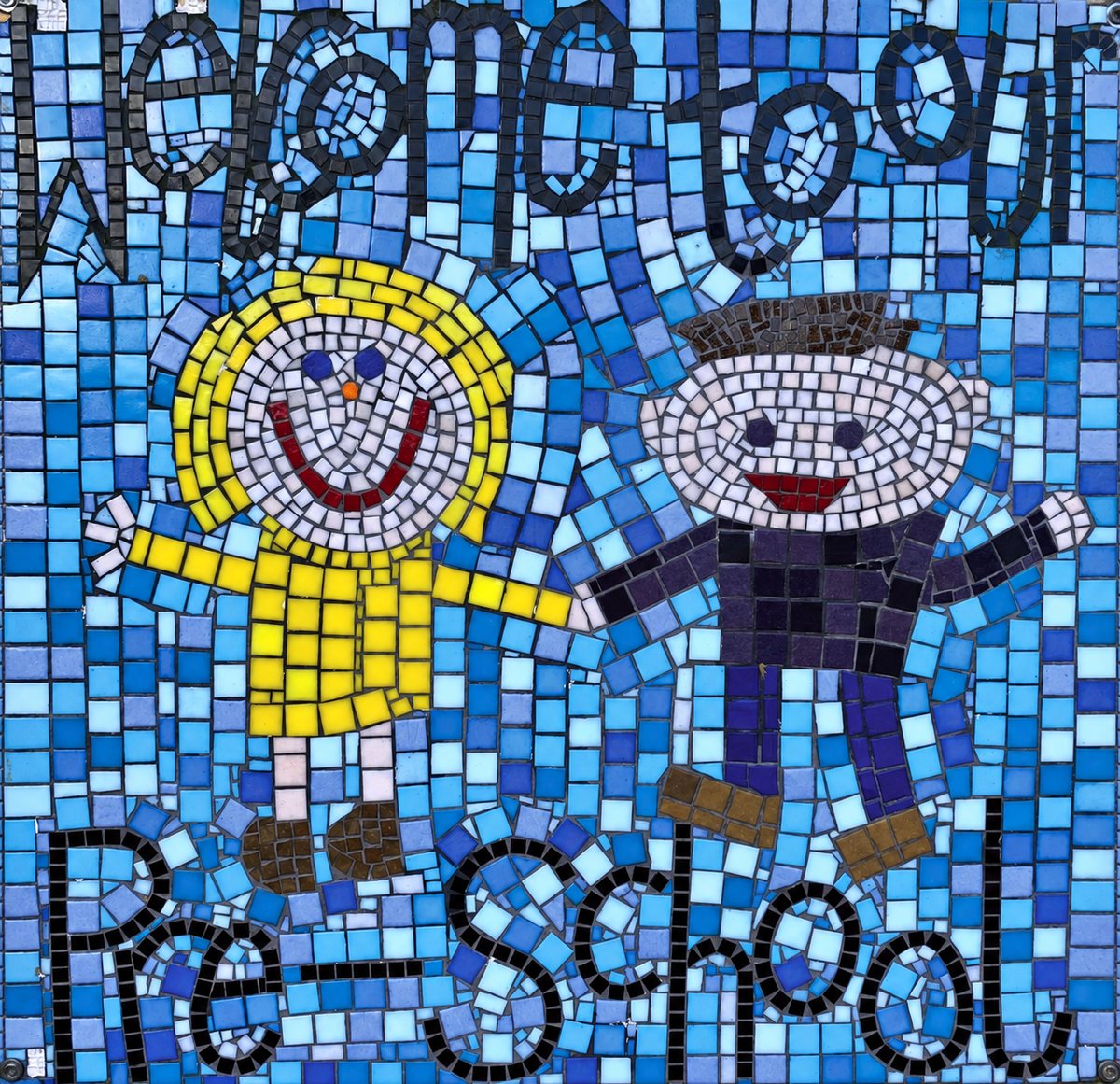 A mosaic made by the children, reading Welcome to our Pre-School